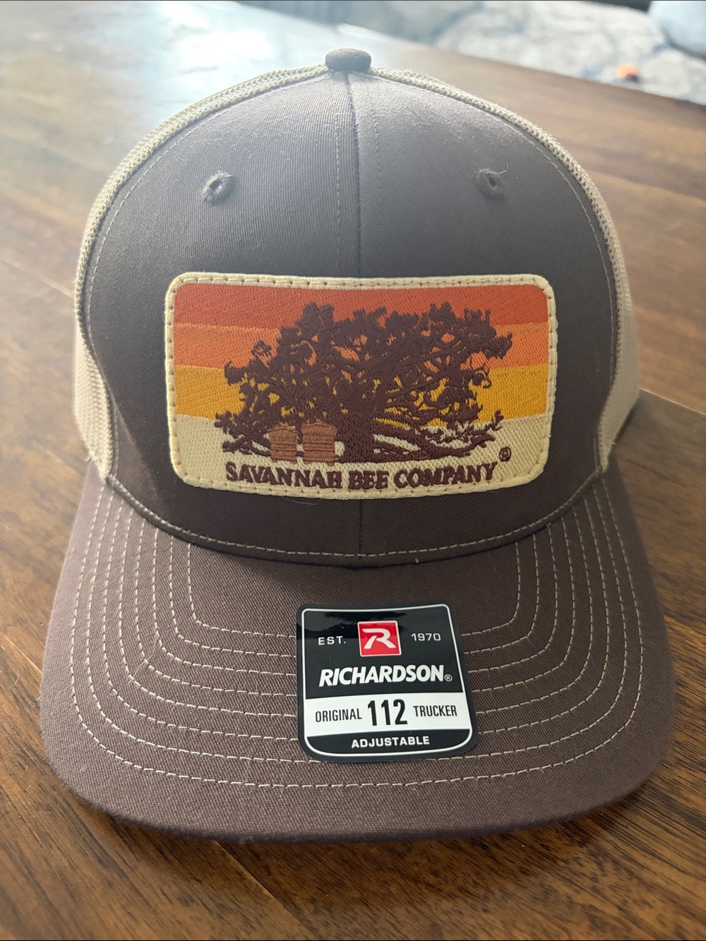 Savannah Bee Company Richardson Trucker Hat - Brown with Orange Stripe Patch